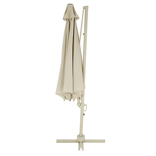 Cream patio umbrella with stand on a white background