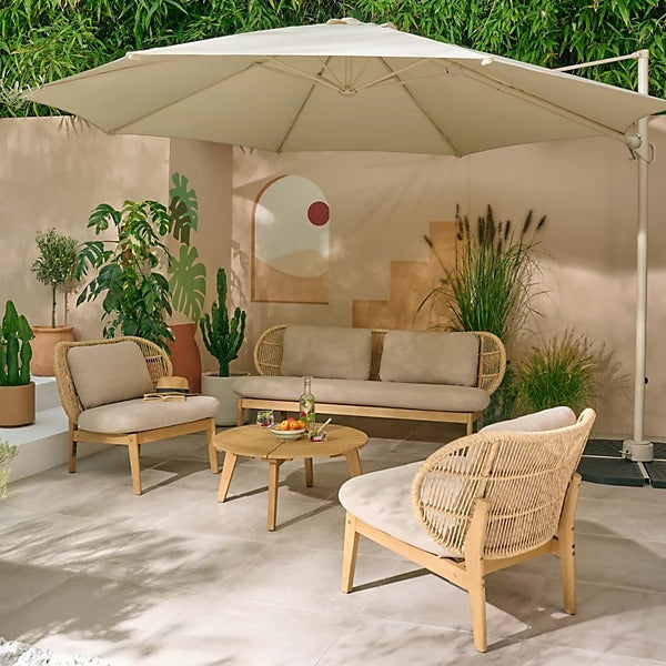 Outdoor patio set with furniture and umbrella in a garden setting